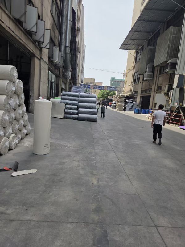 MAGNETEVA factory exterior with raw EVA foam rolls